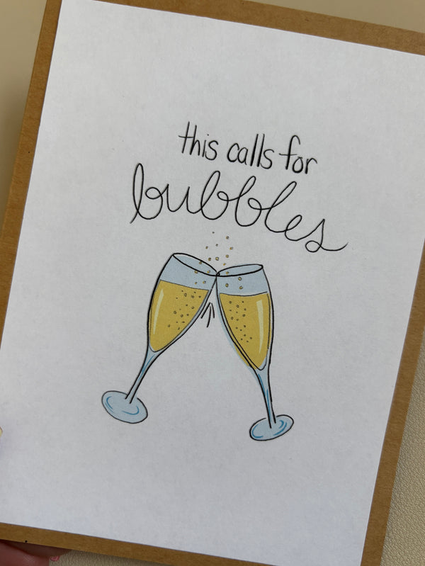 'this calls for bubbles' celebration/congratulations card